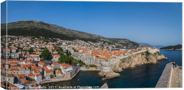 Tourists look out towards the old town of Dubrovni Canvas Print by Jason Wells