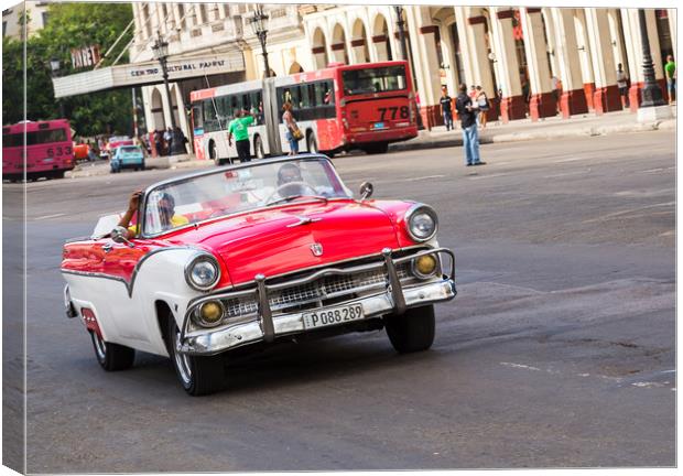 Red and white convertible on the Prado Canvas Print by Jason Wells