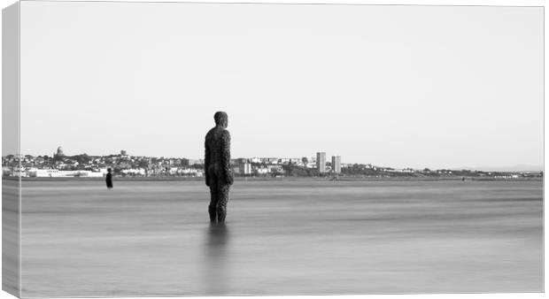 Monochrome Iron Men watching the incoming tide  Canvas Print by Jason Wells