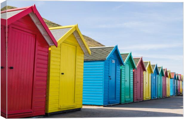 Pretty beach huts in Whitby Canvas Print by Jason Wells