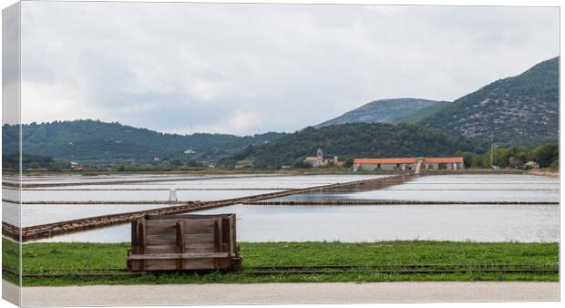 Wooden rail cart in Ston Salt pans Canvas Print by Jason Wells