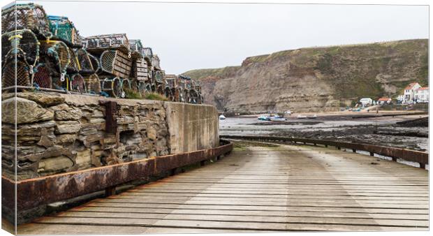 Slipway down to the shoreline at Staithes Canvas Print by Jason Wells