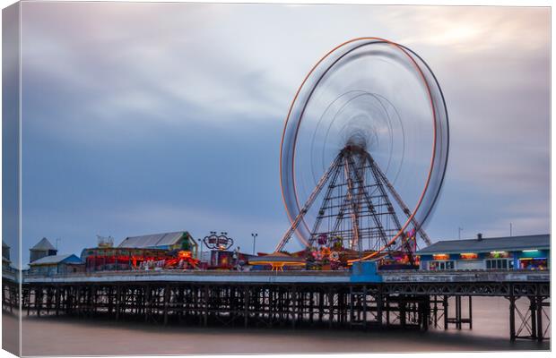 Ferris wheel spinning on Blackpool's Central Pier Canvas Print by Jason Wells