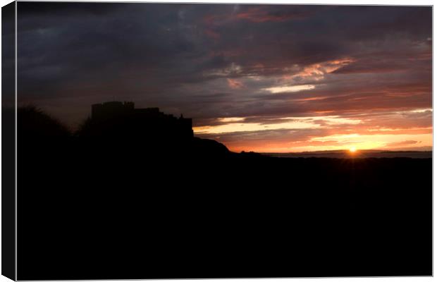 Bamburgh Castle at Sunset Canvas Print by Ivan Kovacs