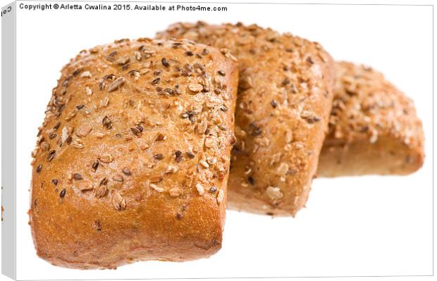 Fresh baked graham bread rolls with seeds  Canvas Print by Arletta Cwalina