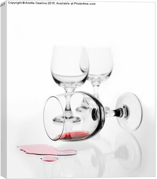 overturned wine glass with red wine splashed out  Canvas Print by Arletta Cwalina