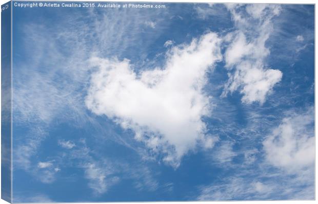 White clouds heart shape authentic Canvas Print by Arletta Cwalina