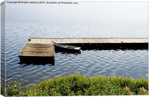 boat moored to old cracked wood bridge  Canvas Print by Arletta Cwalina