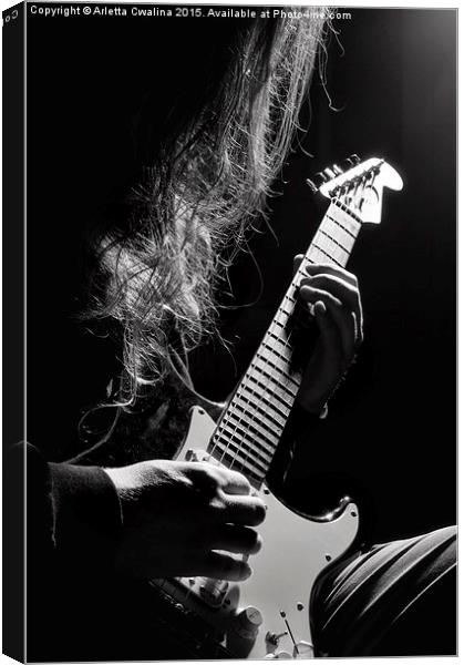 Long hair man playing guitar Canvas Print by Arletta Cwalina