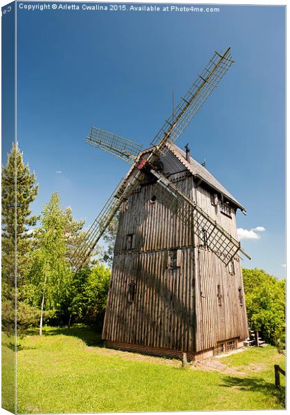 Old wooden windmill building Canvas Print by Arletta Cwalina