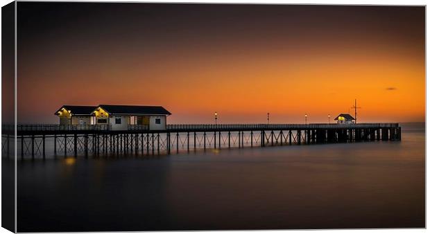  Sunrise glow at Penarth Pier Canvas Print by Dean Merry