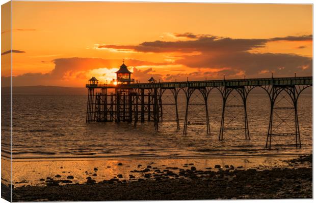 Sun setting at Clevedon Pier Canvas Print by Dean Merry