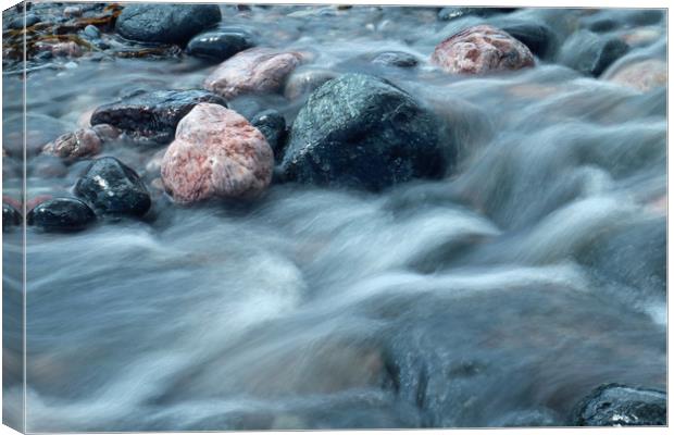 water over pebbles Canvas Print by Michael Hopes