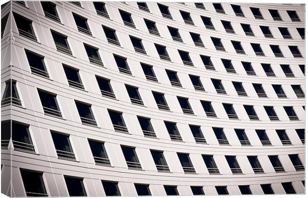 Windows on a curved building Canvas Print by David Clark
