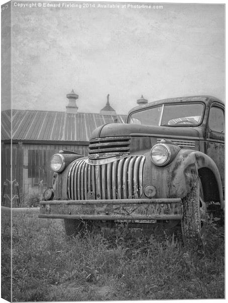 Old farm truck out by the barn Canvas Print by Edward Fielding