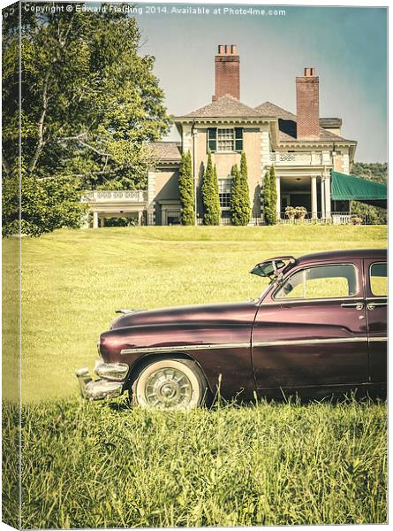 Old classic car in front of large mansion Canvas Print by Edward Fielding