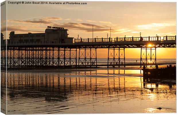 Worthing pier West Sussex Uk. Just before sunset Canvas Print by John Boud