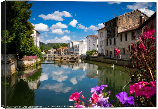 Joinville in France over the canal Canvas Print by Ann Biddlecombe
