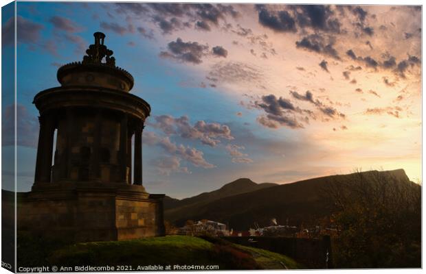 Sunrise over the Burns monument Canvas Print by Ann Biddlecombe