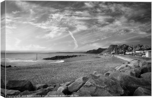 Black and white West bay beach looking towards the cliffs Canvas Print by Ann Biddlecombe