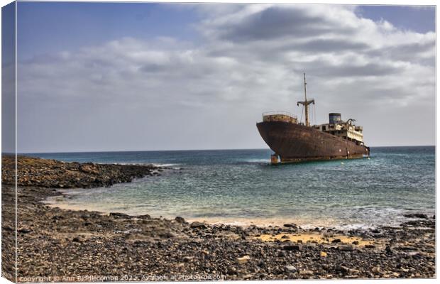 Shipwreck on the walk from Costa Teguise to Arrecife Canvas Print by Ann Biddlecombe