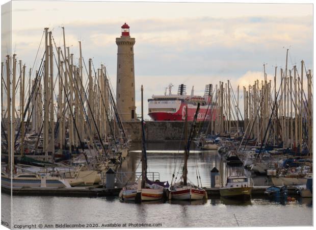 Sete Marina Lighthouse and Ferry Canvas Print by Ann Biddlecombe