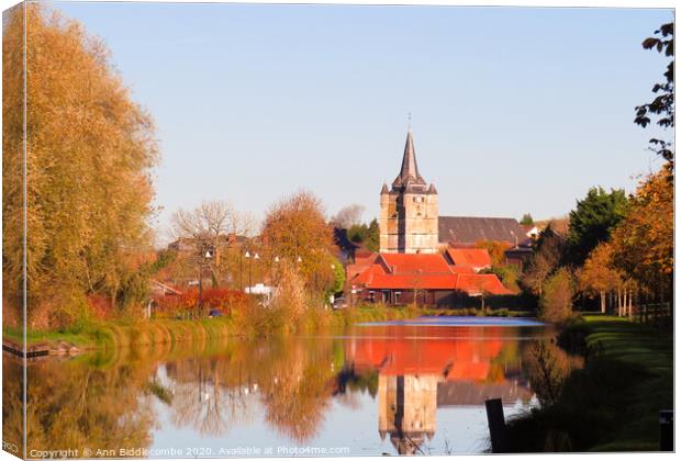 Cappy church reflections on the canal Canvas Print by Ann Biddlecombe