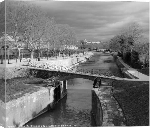 Black and White, Canal du Midi at Beziers looking  Canvas Print by Ann Biddlecombe