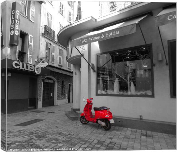 Red Vespa in Cannes Canvas Print by Ann Biddlecombe