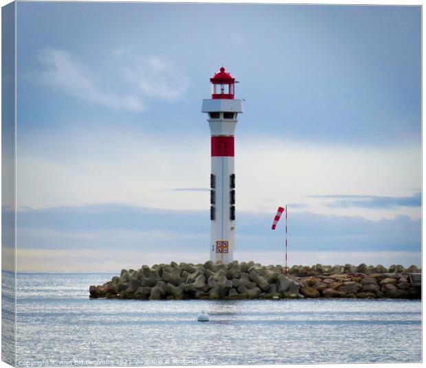 Lighthouse at Cannes Canvas Print by Ann Biddlecombe
