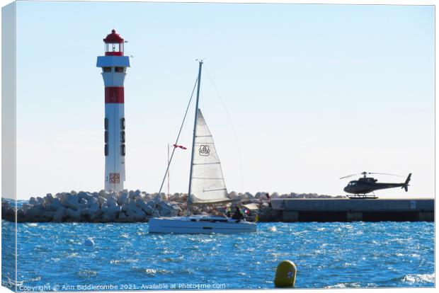 Lighthouse, Yacht and Helicopter in Cannes Canvas Print by Ann Biddlecombe