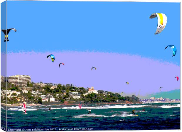 Posterized kite surfers and windsurfers on Palm beach Canvas Print by Ann Biddlecombe