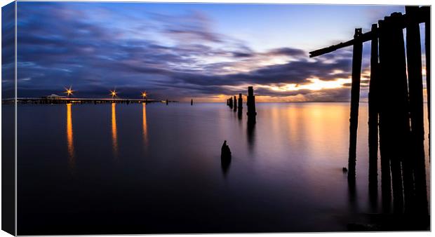 Dawn Breaks over the Pier Canvas Print by Peta Thames
