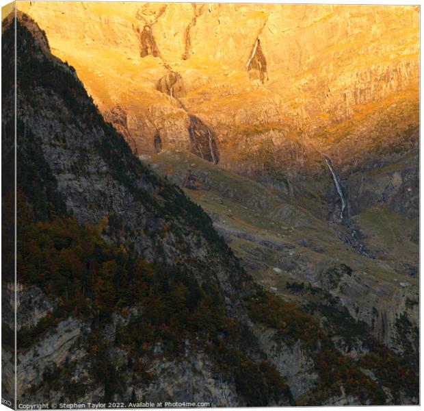 A canyon with a mountain in the background Canvas Print by Stephen Taylor
