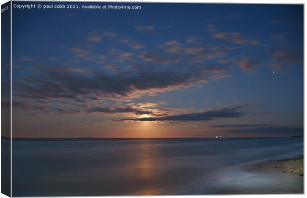 Rising Moon over Serene Beach Canvas Print by paul cobb