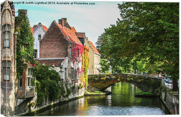 A Little Gem on a Bruges Canal Canvas Print by Judith Lightfoot