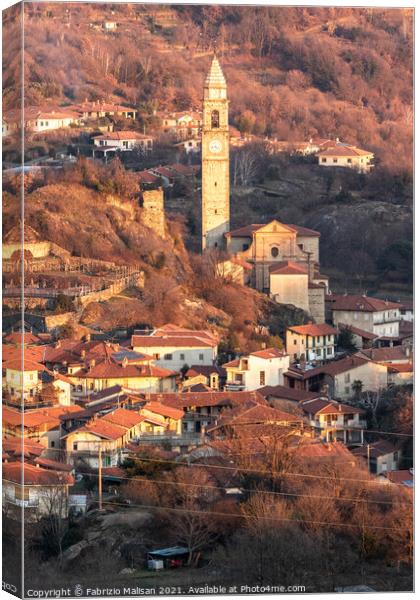 Afternoon sunlight over the village town and churc Canvas Print by Fabrizio Malisan
