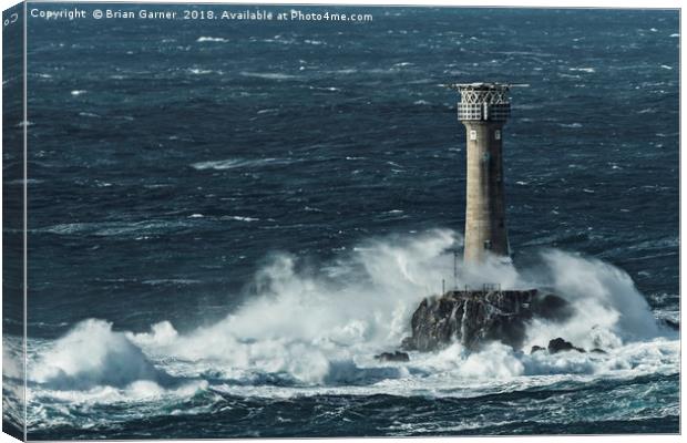 Longships Lighthouse in Rough Sea Canvas Print by Brian Garner