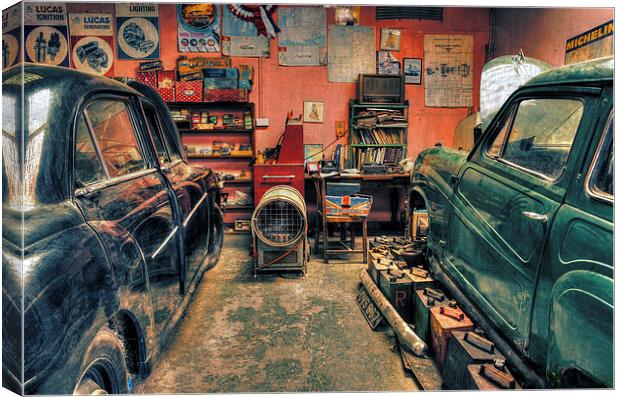  Vintage cars in a garage for repair Canvas Print by Mal Bray