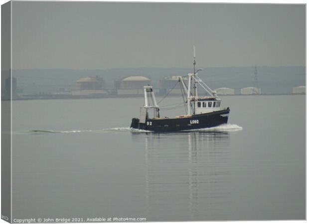 A Cockle Boat returning to Leigh on Sea Canvas Print by John Bridge