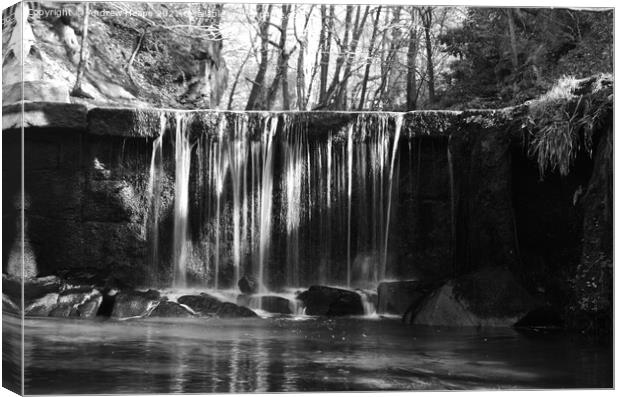 Waterfall with misty water with sun rays  Canvas Print by Andrew Heaps