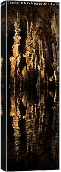 Spectacular stalagmites reflected in water Canvas Print by Mike Marsden