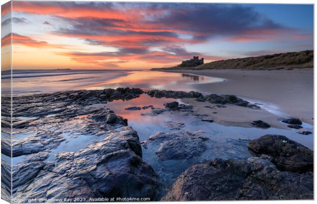 Bamburgh at sunrise Canvas Print by Andrew Ray