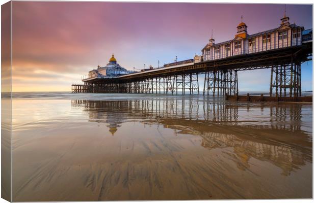 Reflections at sunrise (Eastbourne Pier) Canvas Print by Andrew Ray