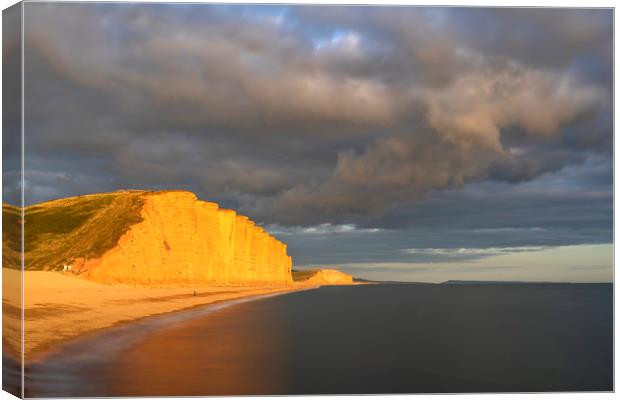 Storm clouds over East Cliff (West Bay) Canvas Print by Andrew Ray