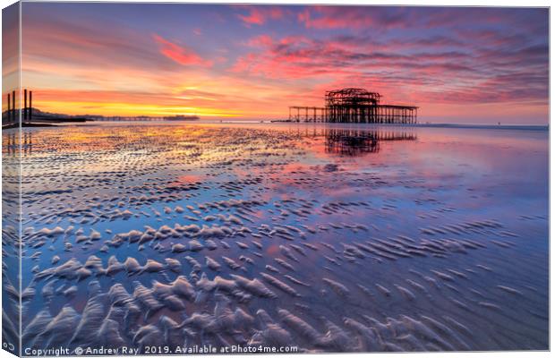 Brighton Beach at sunrise Canvas Print by Andrew Ray
