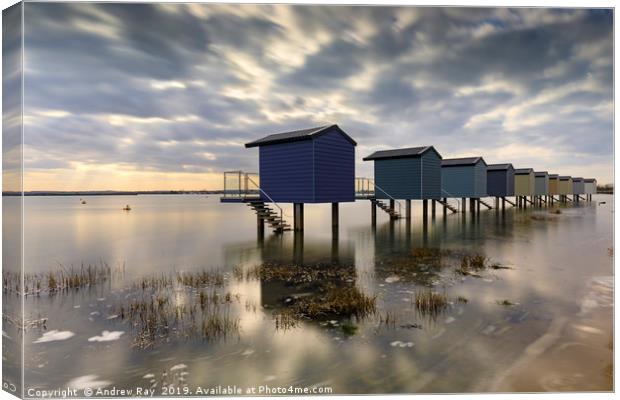High tide at Osea Beach Huts (Blackwater Estuary) Canvas Print by Andrew Ray
