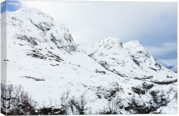 Three Sisters of Glencoe in winter snow Canvas Print by Howard Kennedy