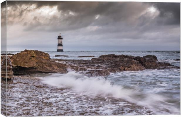 Penmon Point lighthouse wave Canvas Print by Jonathon barnett