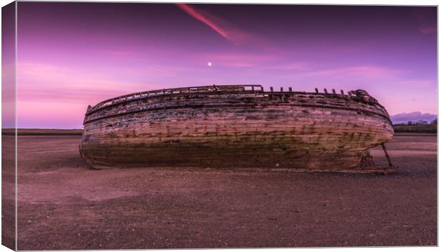 Moon over boat wreck Anglesey Canvas Print by Jonathon barnett